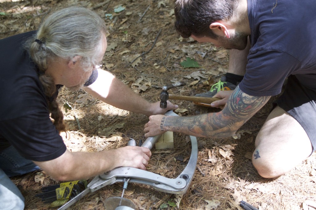 Ken and Joseph installing a new spring.